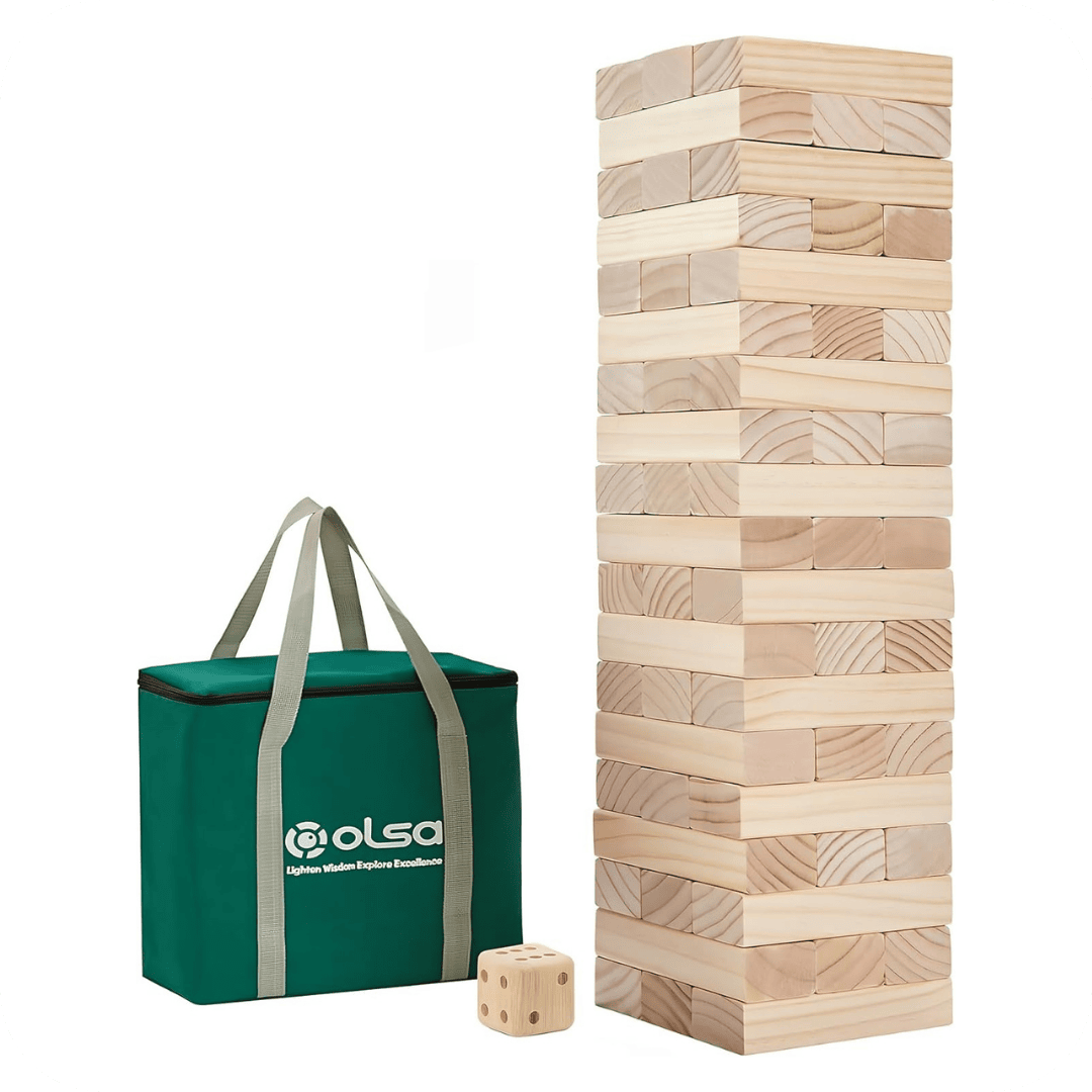 A large stacking block game with natural wood pieces is shown next to a green carrying bag with handles and a wooden die, all placed on a white background.